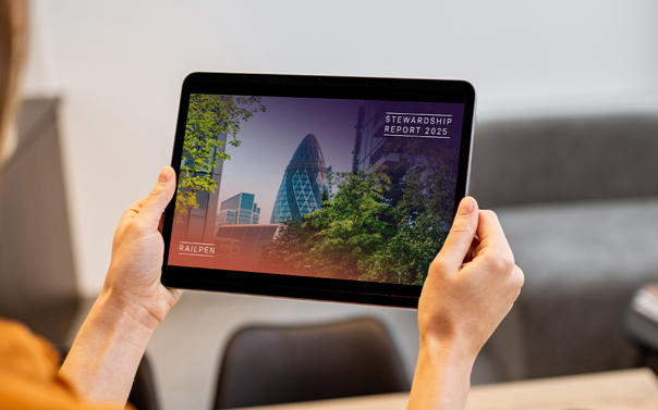 Tablet showing the ‘2025 Stewardship Report' front cover, held.