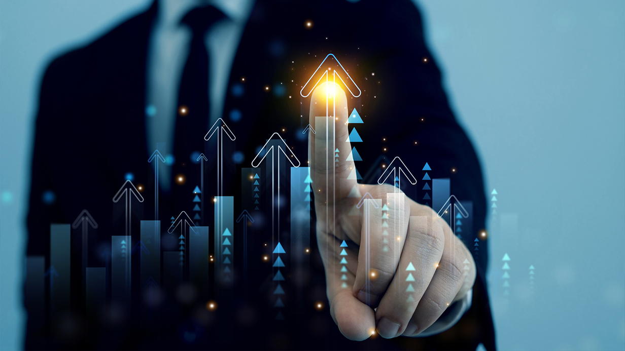 Man's hand interacts with investment graphics