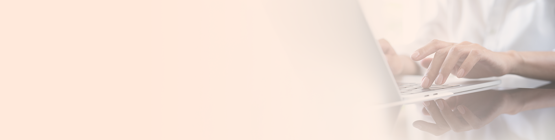 a male hand typing on the laptop