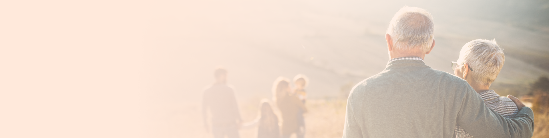 A family - parents with 2 children and grandparents - hiking 